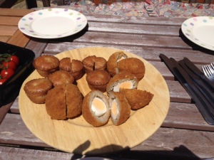 Scotch eggs -- hard boiled eggs, with a layer of pork and then bread crumbs. New one for me!